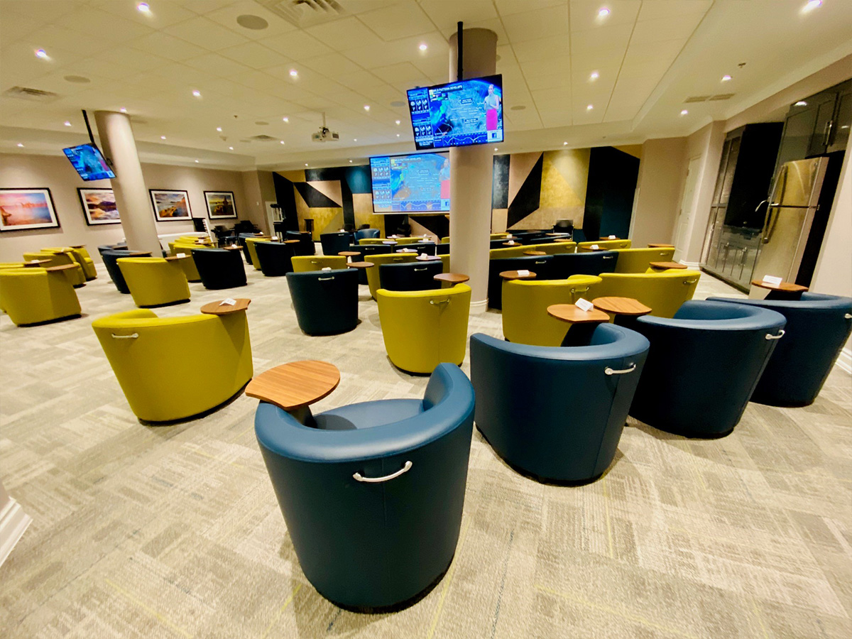 Theatre lounge with comfortable seating and a welcoming space for movies and presentations.